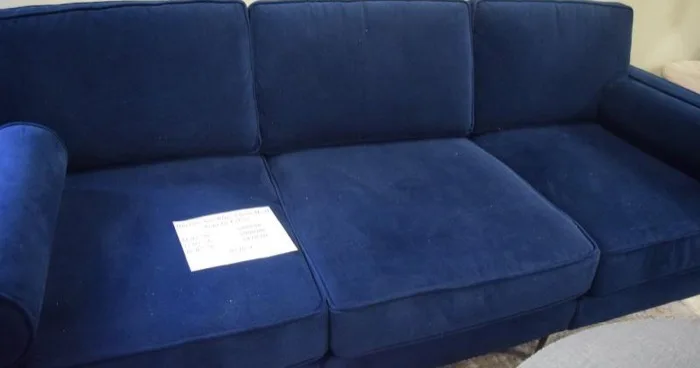 Sea-blue velvet sofa at Elite Repeat Furniture Consignment